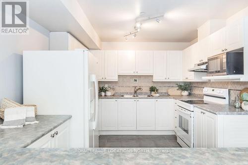 205 - 4 Beck Boulevard, Penetanguishene, ON - Indoor Photo Showing Kitchen With Double Sink