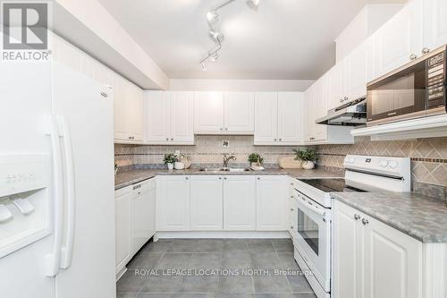 205 - 4 Beck Boulevard, Penetanguishene, ON - Indoor Photo Showing Kitchen With Double Sink