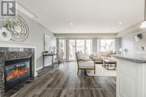 205 - 4 Beck Boulevard, Penetanguishene, ON - Indoor Photo Showing Living Room With Fireplace