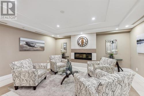 114 - 670 Gordon Street, Whitby (Port Whitby), ON - Indoor Photo Showing Living Room With Fireplace