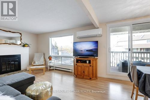 62B - 794 St. Andre Drive W, Ottawa, ON - Indoor Photo Showing Living Room With Fireplace