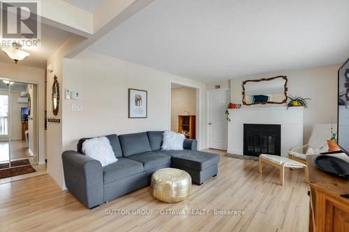 62B - 794 St. Andre Drive W, Ottawa, ON - Indoor Photo Showing Living Room With Fireplace