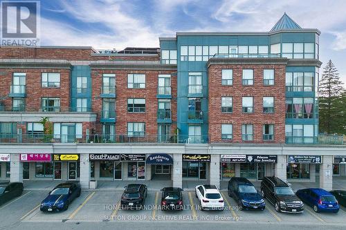 303 - 7378 Yonge Street E, Vaughan, ON - Outdoor With Balcony With Facade