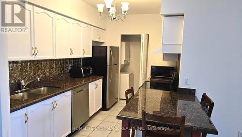 303 - 7378 Yonge Street E, Vaughan, ON - Indoor Photo Showing Kitchen With Double Sink