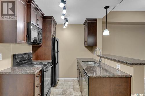 208 1220 Blackfoot Drive, Regina, SK - Indoor Photo Showing Kitchen With Double Sink