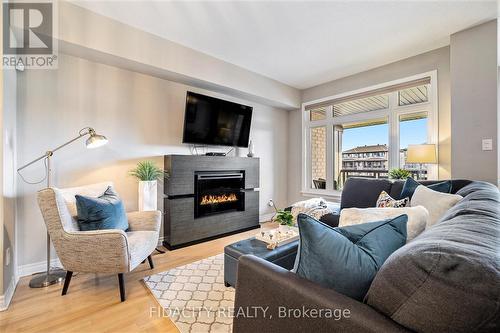 248 Leather Leaf Terrace, Ottawa, ON - Indoor Photo Showing Living Room With Fireplace