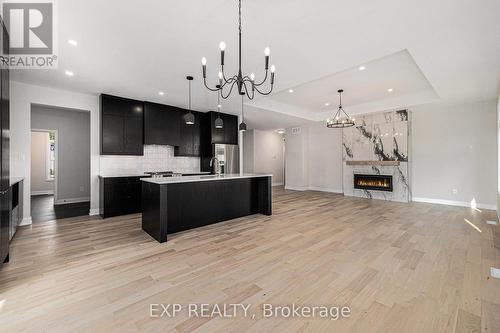 1685 Trizisky Street, North Dundas, ON - Indoor Photo Showing Kitchen With Fireplace With Upgraded Kitchen