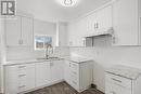 76 Grantham Avenue S, St. Catharines (450 - E. Chester), ON  - Indoor Photo Showing Kitchen With Double Sink 