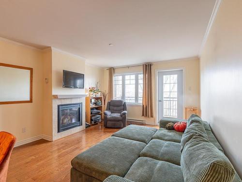 Living room - 408-5211 Rue Du Sureau, Montréal (Pierrefonds-Roxboro), QC - Indoor Photo Showing Living Room With Fireplace