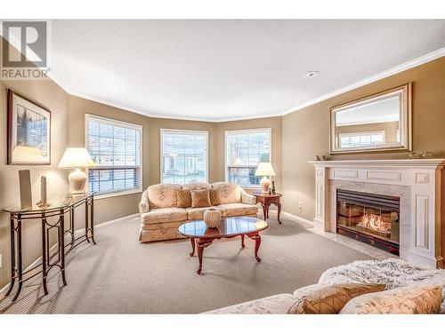 Spacious and Elegant - 595 Yates Road Unit# 34 Lot# 76, Kelowna, BC - Indoor Photo Showing Living Room With Fireplace