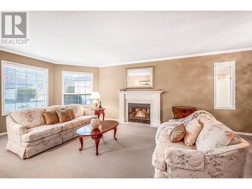 Inviting Gas Fireplace - 595 Yates Road Unit# 34 Lot# 76, Kelowna, BC - Indoor Photo Showing Living Room With Fireplace