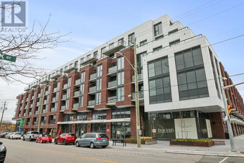 327 - 201 Brock Street S, Whitby, ON - Outdoor With Balcony With Facade