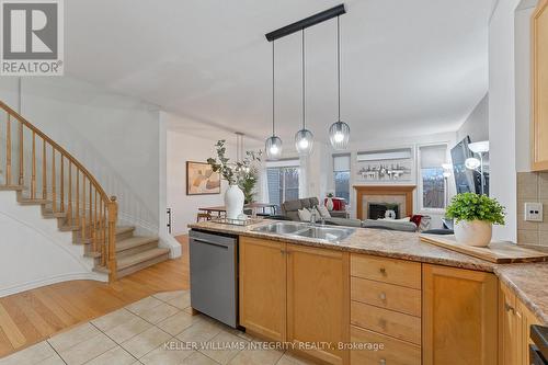 435 Celtic Ridge Crescent, Ottawa, ON - Indoor Photo Showing Kitchen With Fireplace With Double Sink