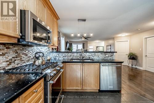 25 Thicketwood Avenue, Barrie, ON - Indoor Photo Showing Kitchen With Fireplace With Double Sink With Upgraded Kitchen