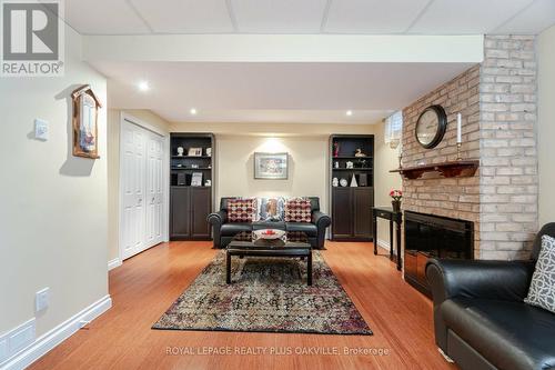 22 - 3125 Fifth Line W, Mississauga, ON - Indoor Photo Showing Living Room With Fireplace