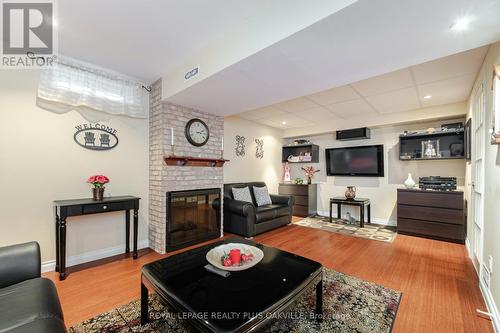 22 - 3125 Fifth Line W, Mississauga, ON - Indoor Photo Showing Living Room With Fireplace