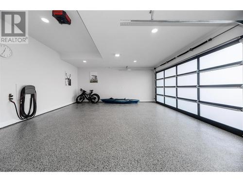 Htd 3 car garage w/epoxy flrs + room for a lift - 509 Eldorado Road, Kelowna, BC - Indoor Photo Showing Garage