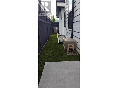 Inspiration for a dog run along north side of house - 509 Eldorado Road, Kelowna, BC - 