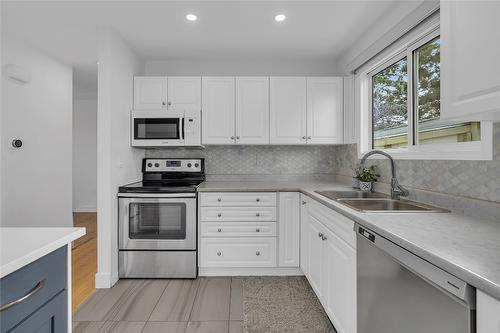 1361 Lambly Place, Kelowna, BC - Indoor Photo Showing Kitchen With Double Sink