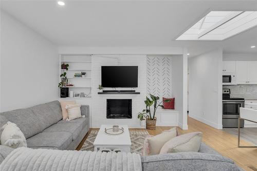 1361 Lambly Place, Kelowna, BC - Indoor Photo Showing Living Room With Fireplace