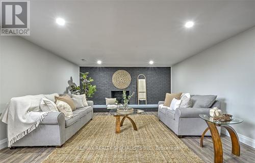 Lower - 1765 Golfview Drive N, Lasalle, ON - Indoor Photo Showing Living Room With Fireplace