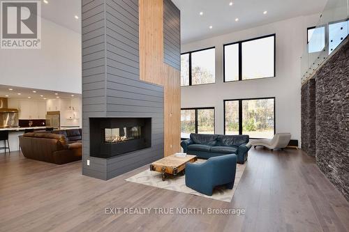 57 Glenhuron Drive, Springwater, ON - Indoor Photo Showing Living Room With Fireplace