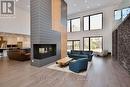 57 Glenhuron Drive, Springwater, ON  - Indoor Photo Showing Living Room With Fireplace 