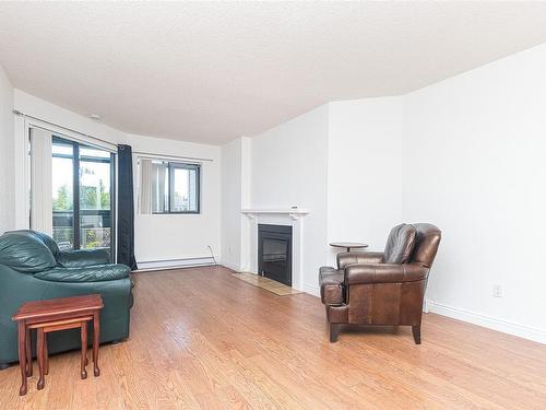 403-1560 Hillside Ave, Victoria, BC - Indoor Photo Showing Living Room With Fireplace