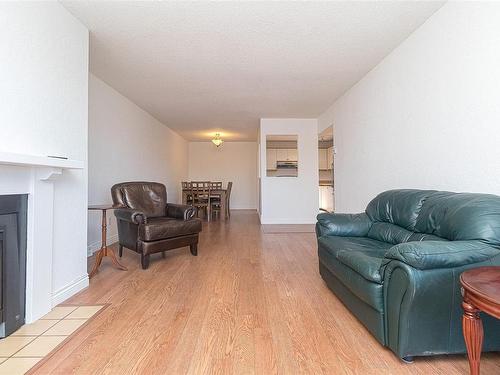 403-1560 Hillside Ave, Victoria, BC - Indoor Photo Showing Living Room With Fireplace