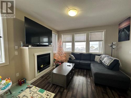 8708 17 Street, Dawson Creek, BC - Indoor Photo Showing Living Room With Fireplace