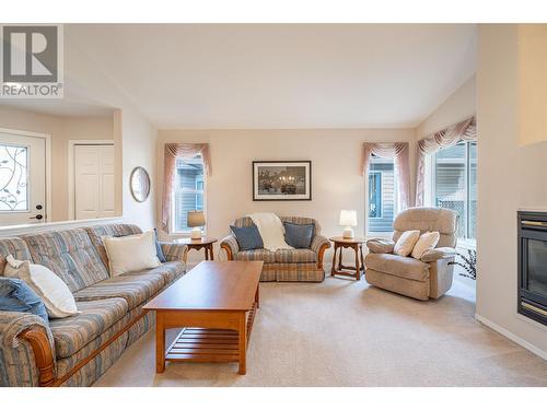 5888 Okanagan Landing Road Unit# 18, Vernon, BC - Indoor Photo Showing Living Room With Fireplace