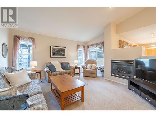 5888 Okanagan Landing Road Unit# 18, Vernon, BC - Indoor Photo Showing Living Room With Fireplace