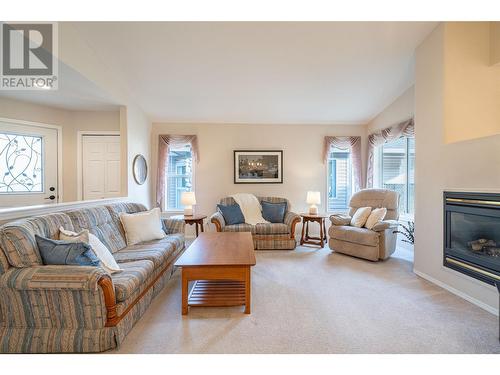 5888 Okanagan Landing Road Unit# 18, Vernon, BC - Indoor Photo Showing Living Room With Fireplace