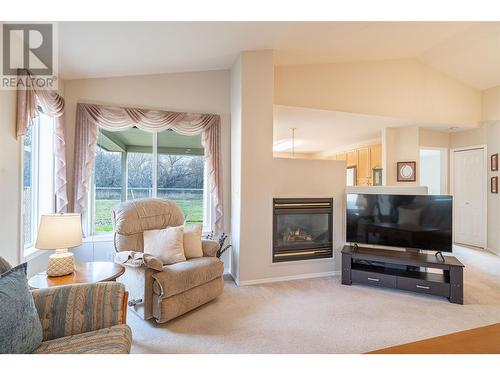 5888 Okanagan Landing Road Unit# 18, Vernon, BC - Indoor Photo Showing Living Room With Fireplace