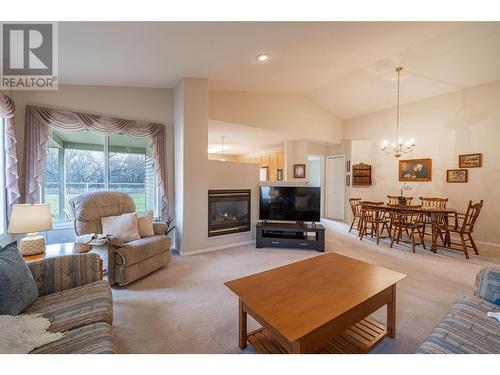 5888 Okanagan Landing Road Unit# 18, Vernon, BC - Indoor Photo Showing Living Room With Fireplace