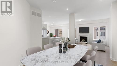 Main/Up - 3938 Koenig Road S, Burlington, ON - Indoor Photo Showing Dining Room With Fireplace