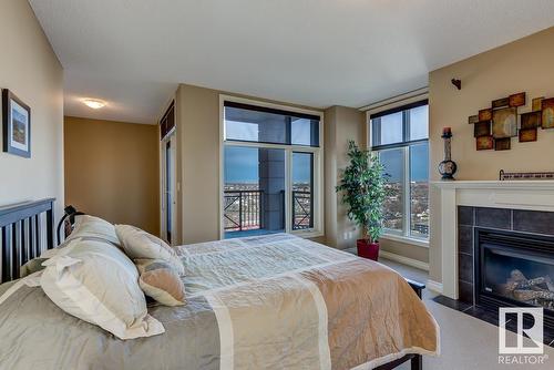 #1701 9020 Jasper Av Nw, Edmonton, AB - Indoor Photo Showing Bedroom With Fireplace