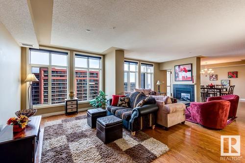 #1701 9020 Jasper Av Nw, Edmonton, AB - Indoor Photo Showing Living Room With Fireplace