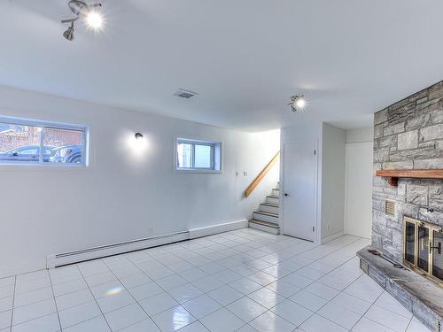 Basement - 10 37E Avenue, Bois-Des-Filion, QC - Indoor With Fireplace