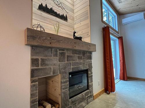 Living room - 180 Ch. Du Domaine-Roger, Lac-Supérieur, QC - Indoor With Fireplace