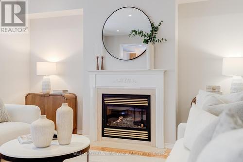 2422 Pilgrim Square, Oshawa, ON - Indoor Photo Showing Living Room With Fireplace