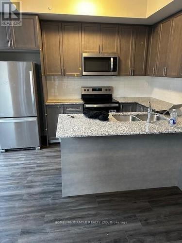 105 - 1569 Rose Way, Milton, ON - Indoor Photo Showing Kitchen With Double Sink