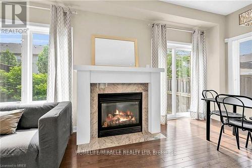 59 - 515 Winston Rd Road, Grimsby, ON - Indoor Photo Showing Living Room With Fireplace