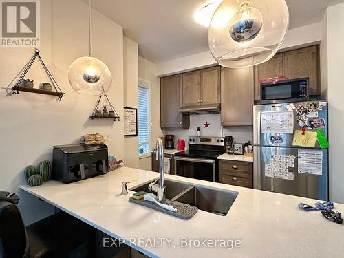 98 - 30 Time Square Boulevard, Hamilton, ON - Indoor Photo Showing Kitchen With Double Sink