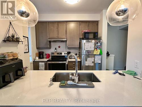 98 - 30 Time Square Boulevard, Hamilton, ON - Indoor Photo Showing Kitchen With Double Sink