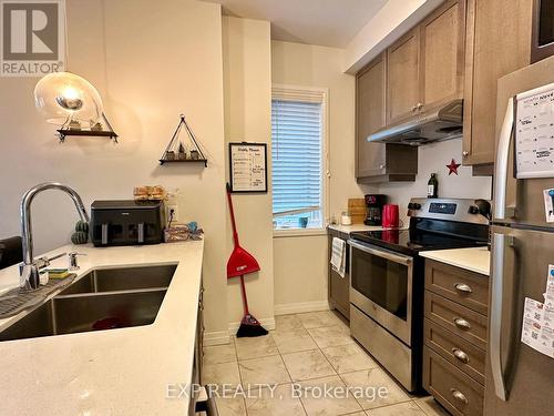 98 - 30 Time Square Boulevard, Hamilton, ON - Indoor Photo Showing Kitchen With Double Sink