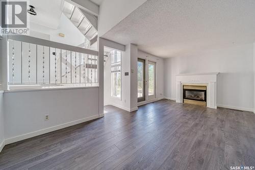 5040 10Th Avenue, Regina, SK - Indoor Photo Showing Living Room With Fireplace