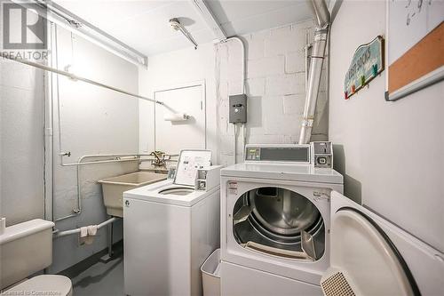 Common laundry area has a monthly fee. - 107 St. Joseph'S Drive Unit# 304, Hamilton, ON - Indoor Photo Showing Laundry Room