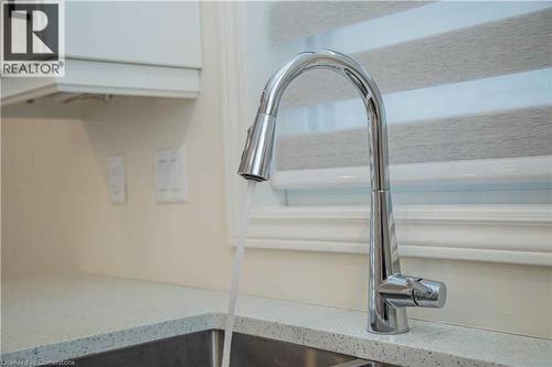 Details featuring light stone countertops and sink - 182 Byers Street, London, ON - Indoor Photo Showing Other Room