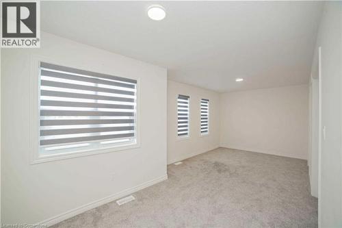 Unfurnished room featuring light colored carpet - 182 Byers Street, London, ON - Indoor Photo Showing Other Room